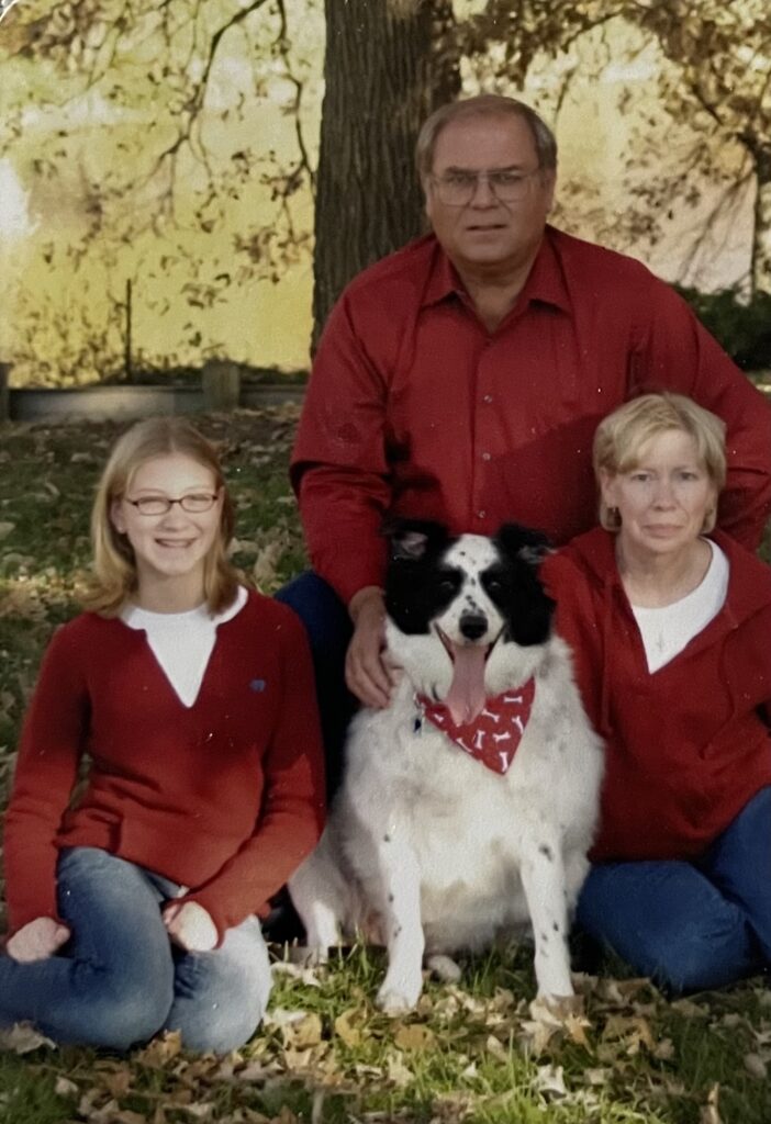 family wearing matching red outfits for family pictures